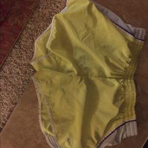 Nike running shorts yellow and purple!